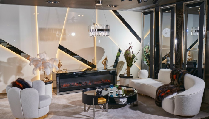 Luxurious white living room set with 3-seater, armchair, round coffee table.