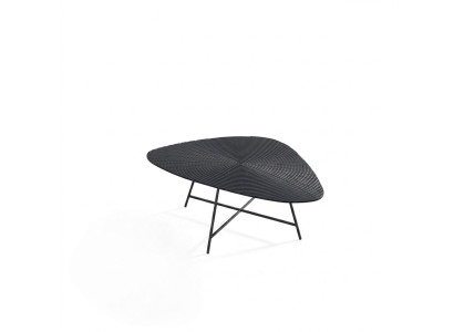Stylish black coffee table for the living room with a carved tabletop