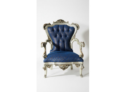 A fabulous armchair in classic style in blue with decorative patterns