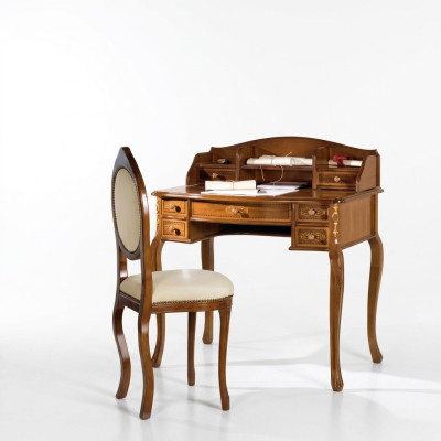 Classic desk with a brown wooden chair in a study.