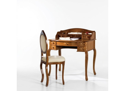 Classic desk with a brown wooden chair in a study.