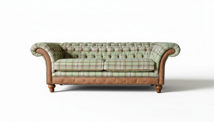 Luxurious designer sofa in Chesterfield design with three seats.