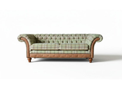 Luxurious designer sofa in Chesterfield design with three seats.