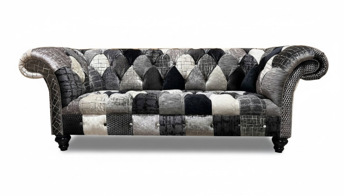 Luxurious velvet sofa in Chesterfield design with colorful checks