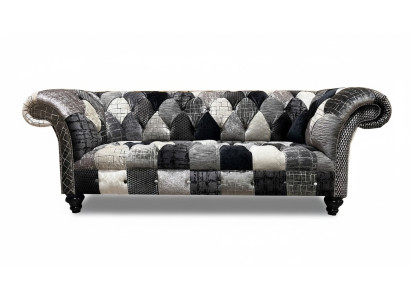 Luxurious velvet sofa in Chesterfield design with colorful checks