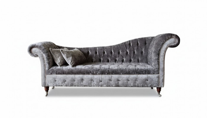 A luxurious, classic Chesterfield-style sofa in a rich silver tone.