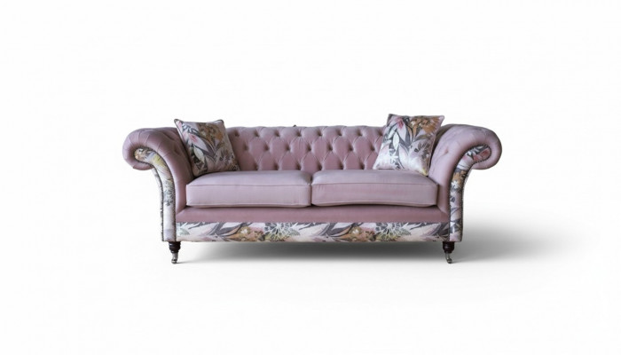 A lively three-seater Chesterfield sofa with a delicate pink floral pattern