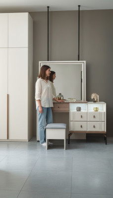 White vanity table with glass mirror, luxurious upholstered stool, modern furniture