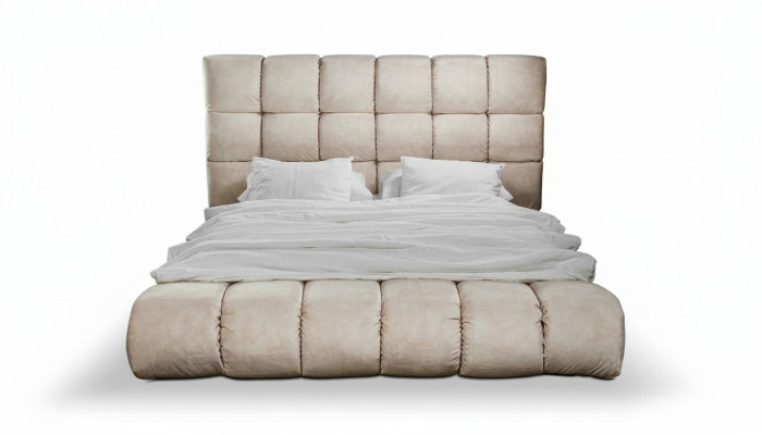 Luxury plush bed in the bedroom, large, handy designer bed, new interior.