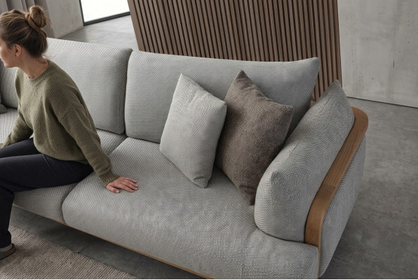 Luxurious 3-seater sofa, light color, modern furniture in living room