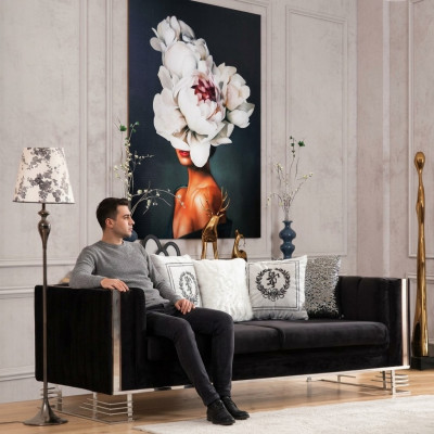 Black designer three-seater living room couch with metal frame