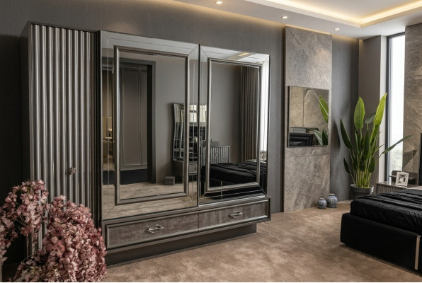 Designer wooden wardrobe with mirrored doors and drawers bedroom