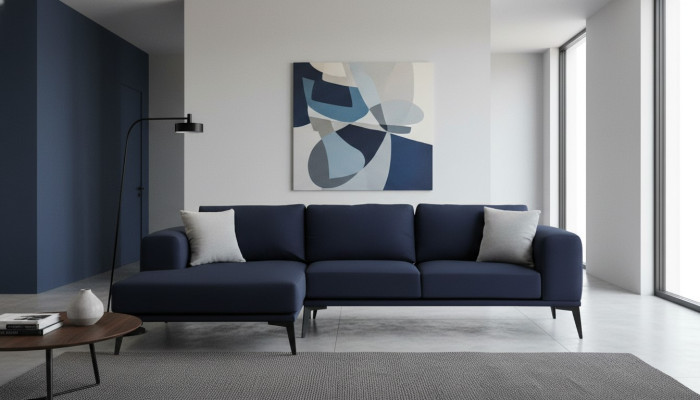 L-shaped corner sofa, dark blue, solid color, textile material with cushions, living room.