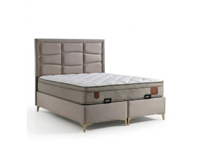 Beige bed with fabric and wood pillow