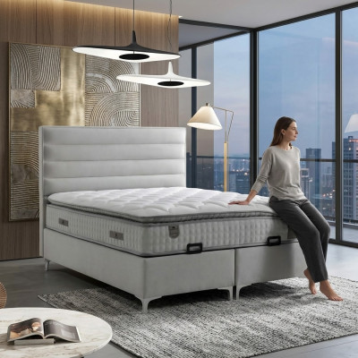 Bed made of modern gray textile with elegant mattress