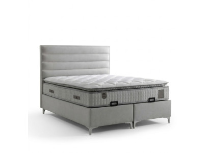 Bed made of modern gray textile with elegant mattress