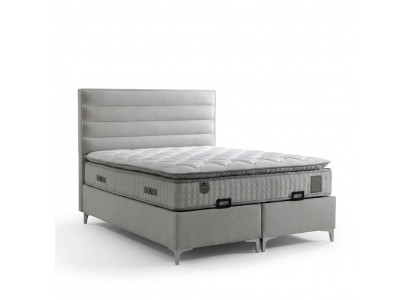 Bed made of modern gray textile with elegant mattress